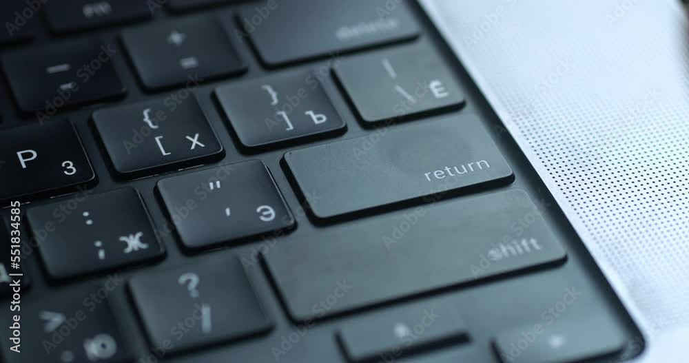 Close up male's finger aggressively presses the enter key several times