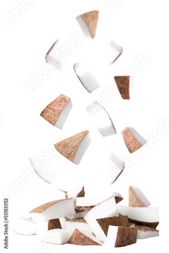 Flying chopped pieces of coconuts isolated on transparent background. photo