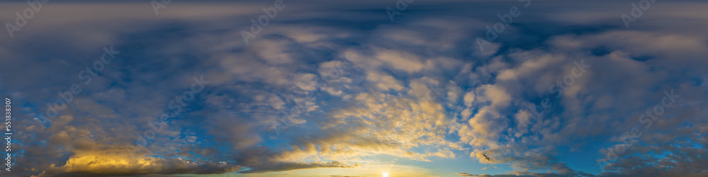 Obraz premium Panorama of a dark blue sunset sky with golden Cumulus clouds. Seamless hdr 360 panorama in spherical equiangular format. Full zenith for 3D visualization, sky replacement for aerial drone panoramas.
