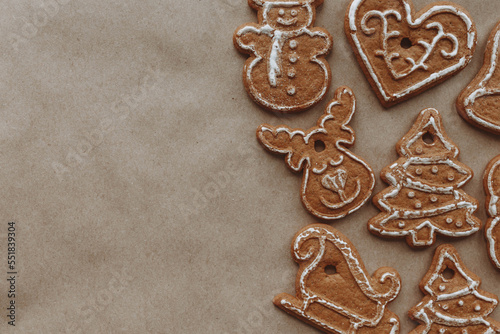 Christmas gingerbread on a craft background. Festive layout