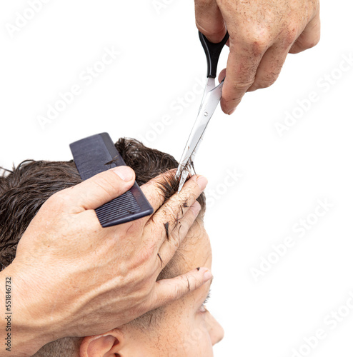 The barber cuts a man's haircut with scissors