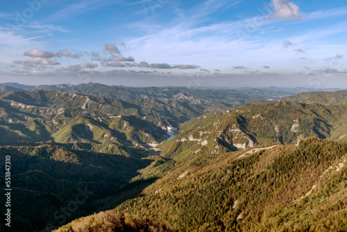 Panoramic view from the top of Monte Penna, on the surrounding mountains, between Tuscany and Emilia Romagna, Italy, with the lake and the Ridracoli dam in the background photo