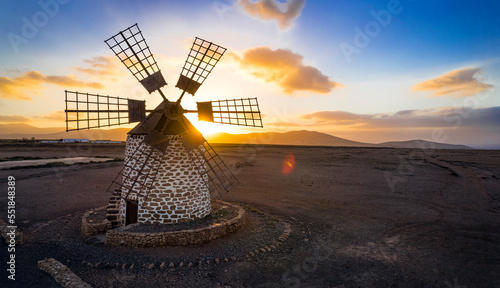 Spanish windmill over sunset. Scenery of Fuerteventura Canary island. aerial drone view of Tefia windmills