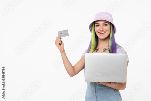 Caucasian young modern teenage girl hipster using laptop and credit card for e-banking online shopping e-commerce isolated in white background. Sale discount offer loan debt