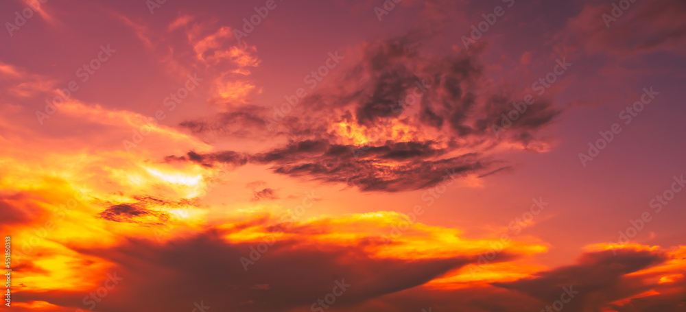 Amazing panoramic sunrise or sunset sky with gentle colorful clouds. Long panorama, crop it.