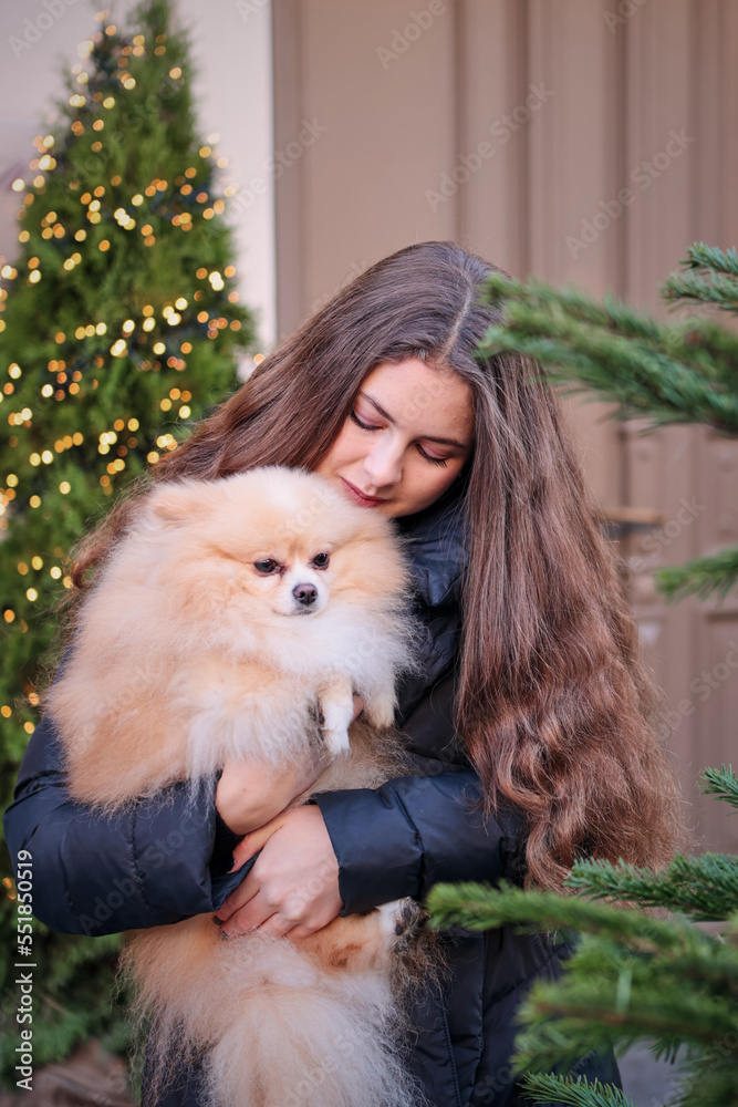young girl with spitz dog young girl with spitz dog