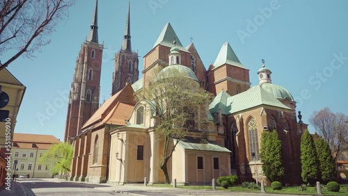 View of the Cathedral of St. John the Baptist in Wroclaw on Ostrow Tumski. Old town, Poland, church, architecture, Roman Catholic, gothic, neo-gothic, gimbal. 4K Video Footage.