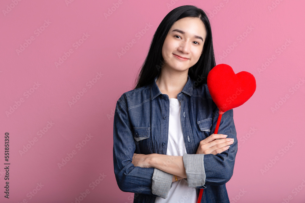 Portrait of lovely asia woman embracing heart isolated on pink background , Red heart symbol of Valentines day smiling asian woman hold. Portrait of lovely asia woman embracing heart isolated on pink background , Red heart symbol of Valentines day smiling asian woman hold.