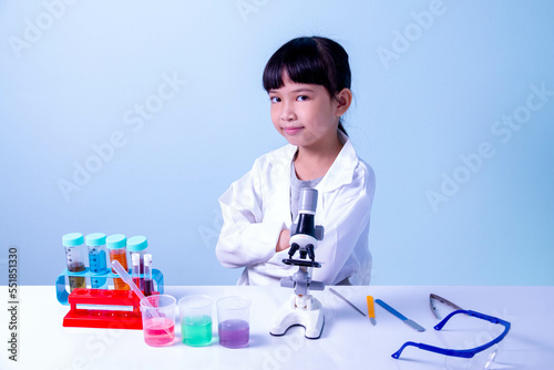 Kid scientists studying science, experimenting with chemicals or microscope, Young scientist making experiments in home laboratory, Child and science, children making science experiments, Education.