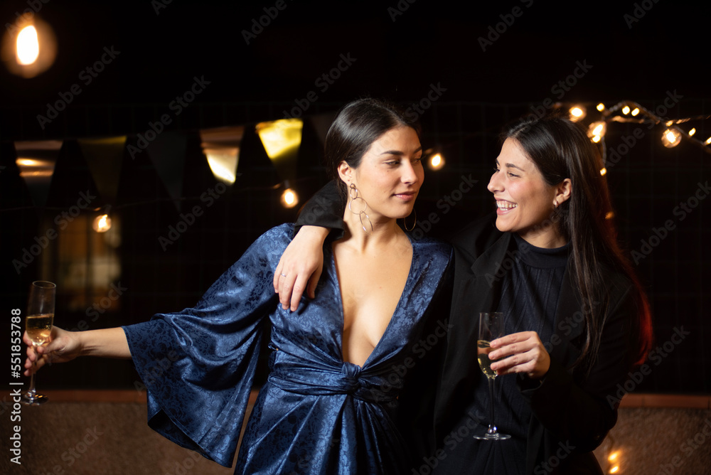 two twin sisters in elegant party dresses looking at each other, girl dress girl dress girl suit style