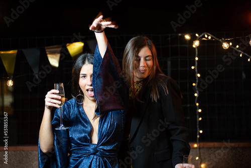 two young girls dancing sexily at a party night photo