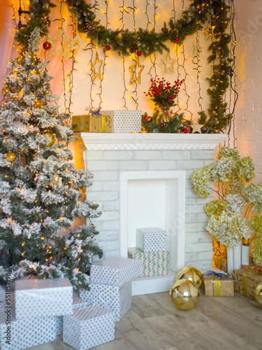 Beautiful Christmas interior. Christmas tree and fireplace