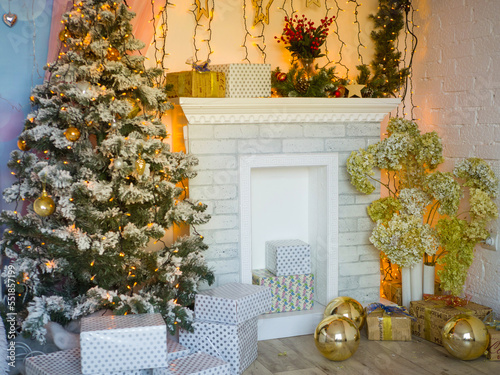 Beautiful Christmas interior. Christmas tree and fireplace