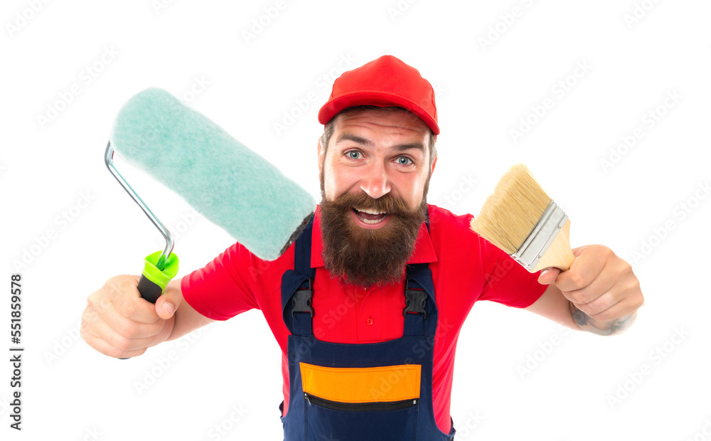 happy decorator with paintroller and paint brush. decorator with paintroller in uniform.