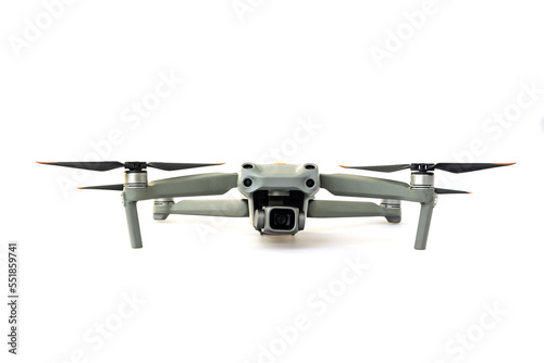 Drone quadcopter with digital camera and sensors flying isolated on white background.