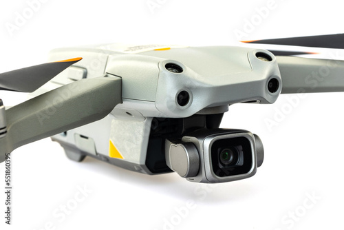 Drone quadcopter with digital camera and sensors flying isolated on white background.