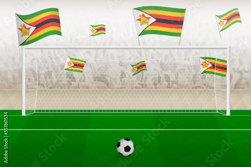 Zimbabwe football team fans with flags of Zimbabwe cheering on stadium, penalty kick concept in a soccer match.