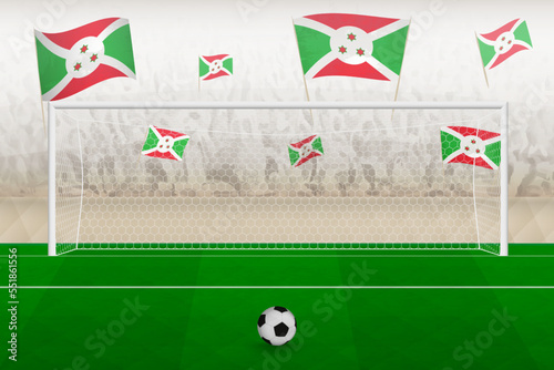 Burundi football team fans with flags of Burundi cheering on stadium, penalty kick concept in a soccer match.