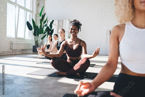 Fototapeta Naklejka Na Ścianę i Meble -  Diverse women meditating in yoga class