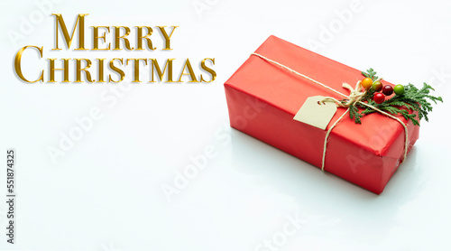 Christmas decoration. Text in golden letters wishing Merry Christmas.