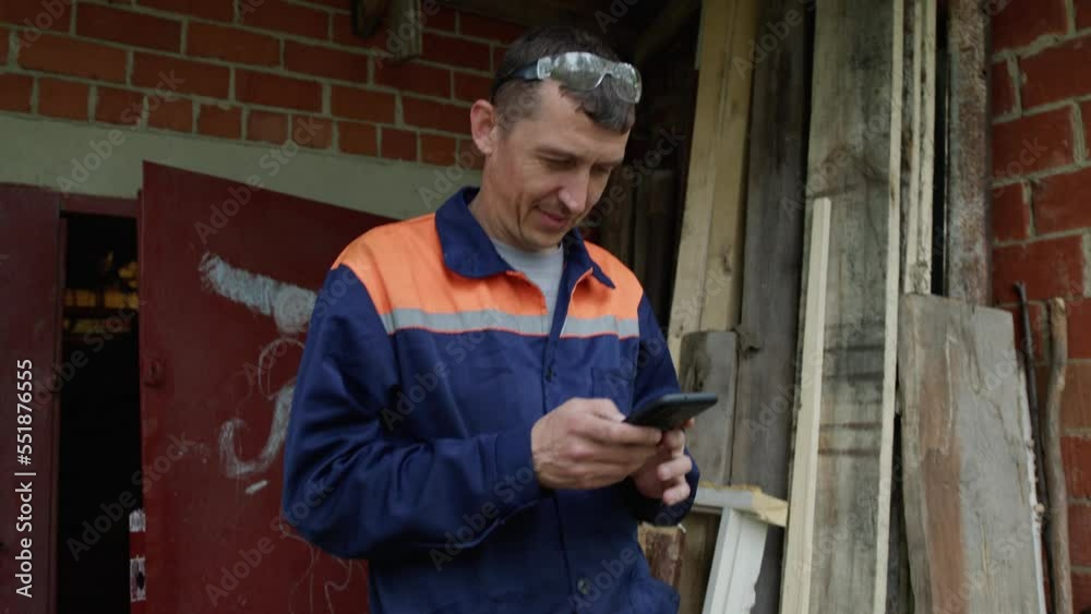 Man reading a message on his phone Man reading a message on his phone