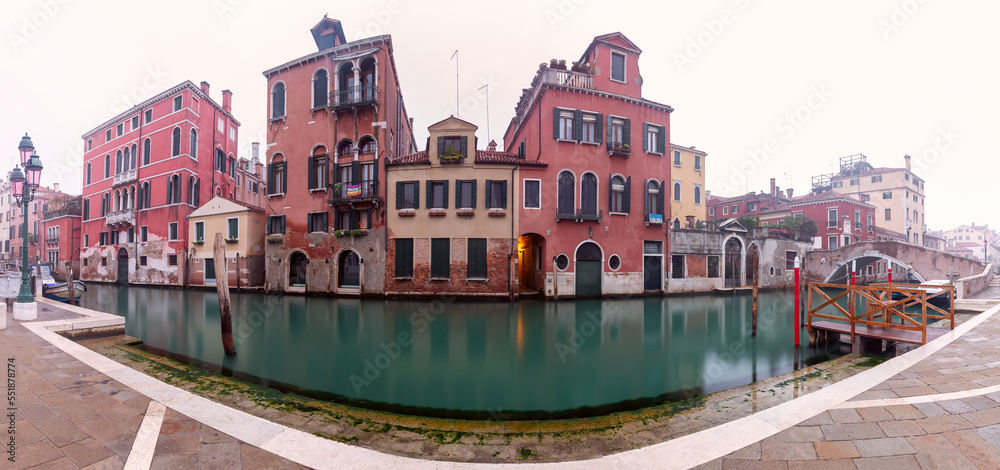 Traditional Venetian houses along the canal at sunrise.