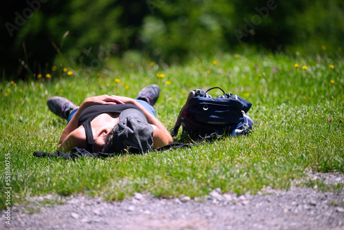 person relaxing on the grass photo