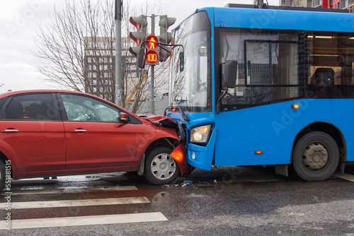 Frontal collision of a car and a bus.  Head-on collision between bus and car. Car accident. Traffic accident.