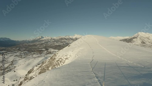 Fly over the top of the snowy Puy de Manse hill