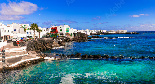 Fototapeta Naklejka Na Ścianę i Meble -  Lanzarote scenic places. view of Punta Mujeres traditional fishing village with crystal sea and white houses. popular  for natural swim pools. Canary islands travel