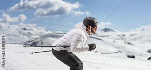 Profile shot of a male skier skiing