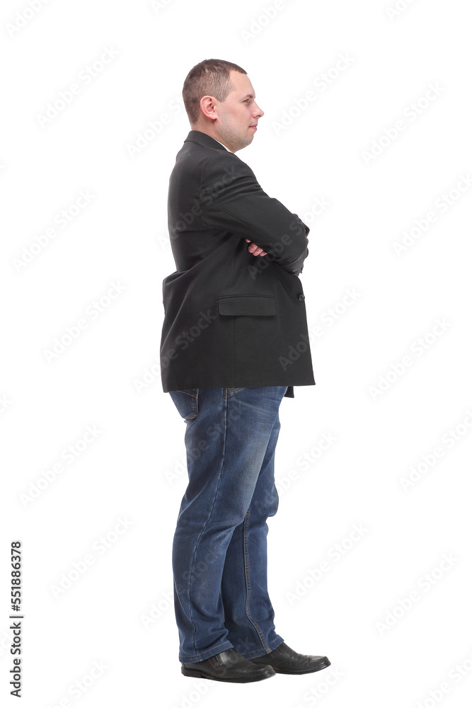 Side view of confident businessman with arms folded against white background Side view of confident businessman with arms folded against white background
