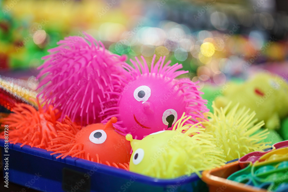 Colorful funny toys hedgehogs in Pink, Yellow, orange color made of rubber or plastic selling in indian fair market