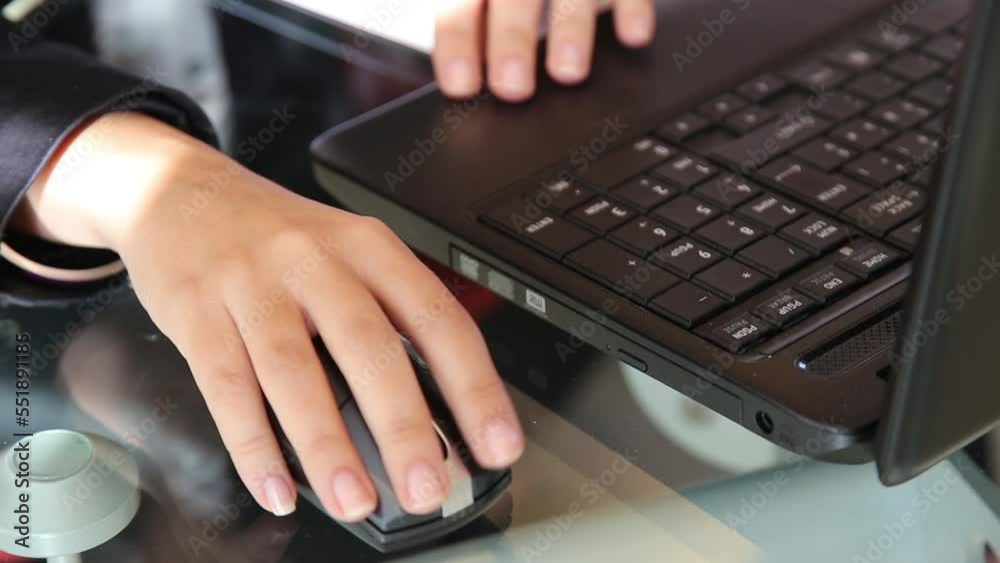 Woman hands typing on the laptop and use mouse. Concept of Teamwork Brainstorming Meeting in a modern office Woman hands typing on the laptop and use mouse. Concept of Teamwork Brainstorming Meeting in a modern office
