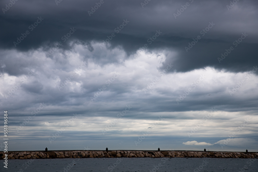 Obraz premium seascape with dark clouds and light