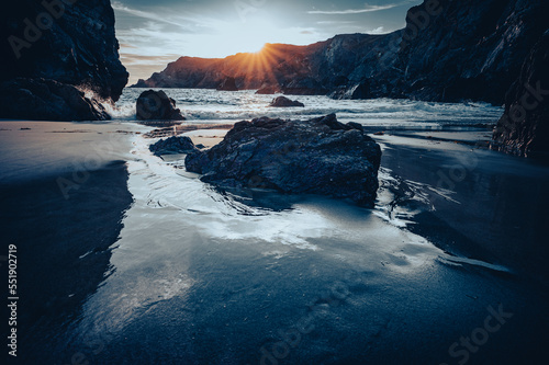 Sunset at kynance cove in Cornwall .