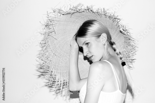 Portrait of young attarctive woman in straw hat 