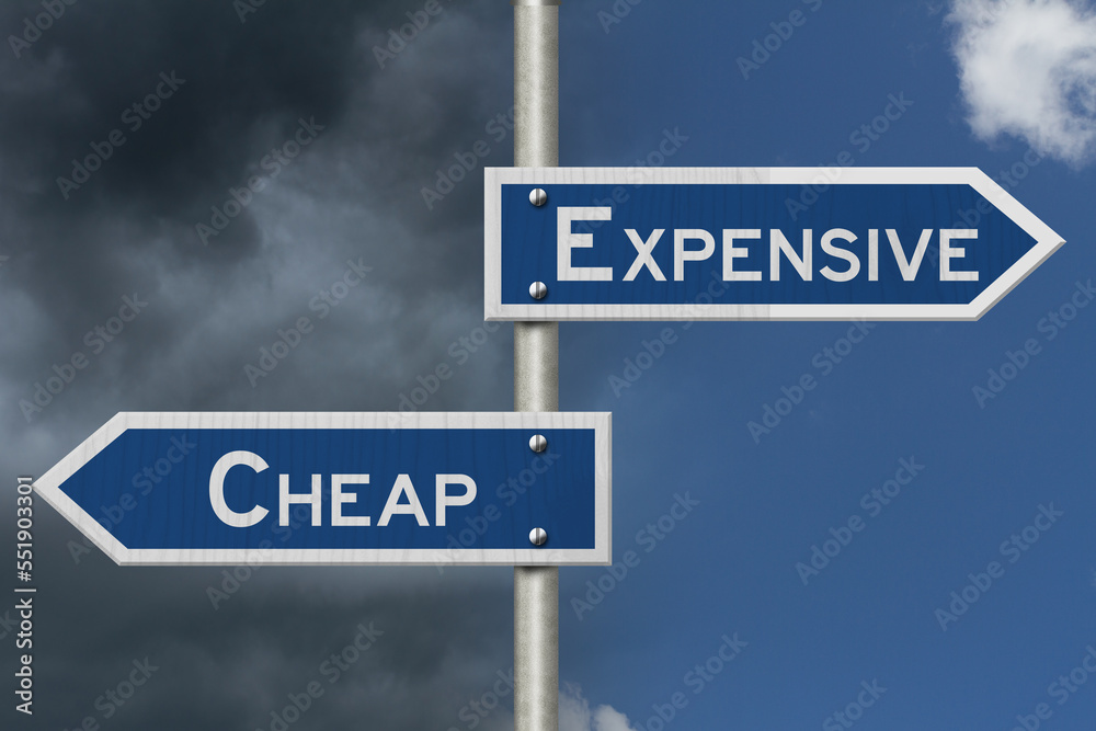 Expensive versus Cheap blue road sign Expensive versus Cheap blue road sign