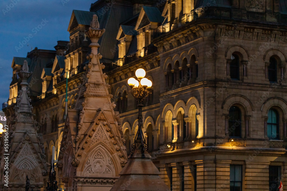Cityscape of downtown Ottawa, Canada at night with street lights and historic government buildings. Cityscape of downtown Ottawa, Canada at night with street lights and historic government buildings.
