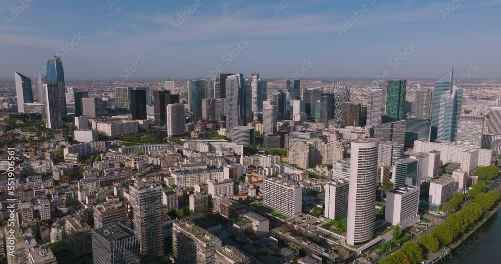 The Parisian skyscrapers in the heart of the business district near the River Seine in France are filmed from a drone. Flying a drone near a popular business center. Manhattan in the center of Europe The Parisian skyscrapers in the heart of the business district near the River Seine in France are filmed from a drone. Flying a drone near a popular business center. Manhattan in the center of Europe