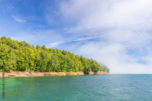 Sandstone cliffs along foggy Lake Superior at Pictured Rocks National Lakeshore, Michigan, USA