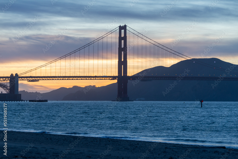 Golden Gate Bridge against a purple pink yellow blue evening sky. Golden Gate Bridge against a purple pink yellow blue evening sky.