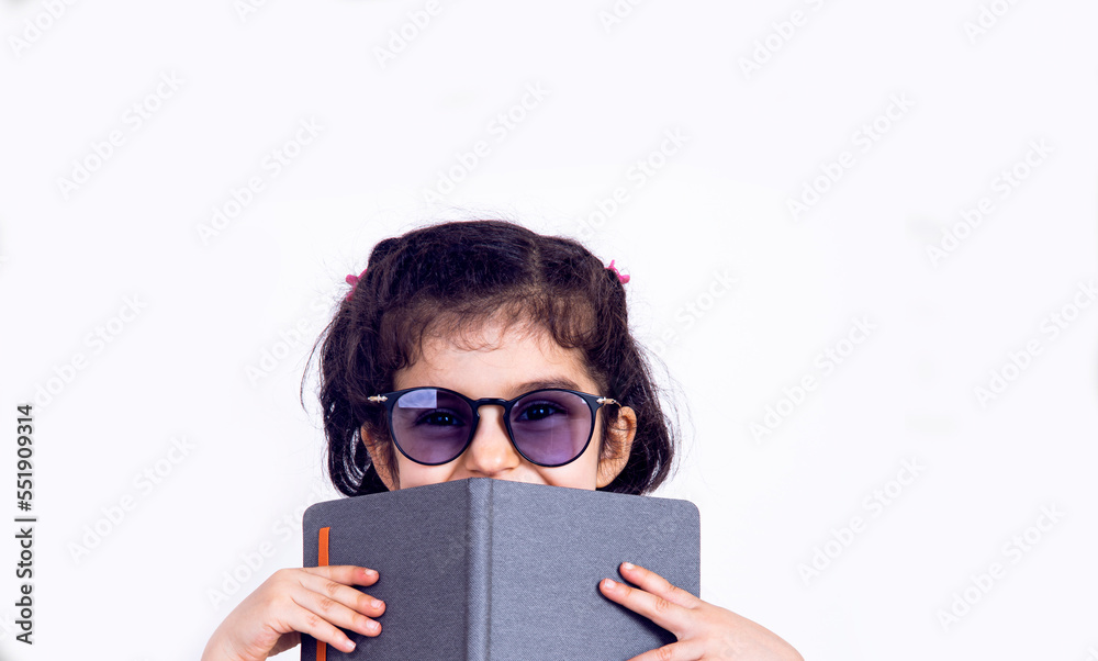 Cute young kid girl drawing or painting with colored pencil. Kindergarten children education, back to school, or preschool child study at home Cute young kid girl drawing or painting with colored pencil. Kindergarten children education, back to school, or preschool child study at home