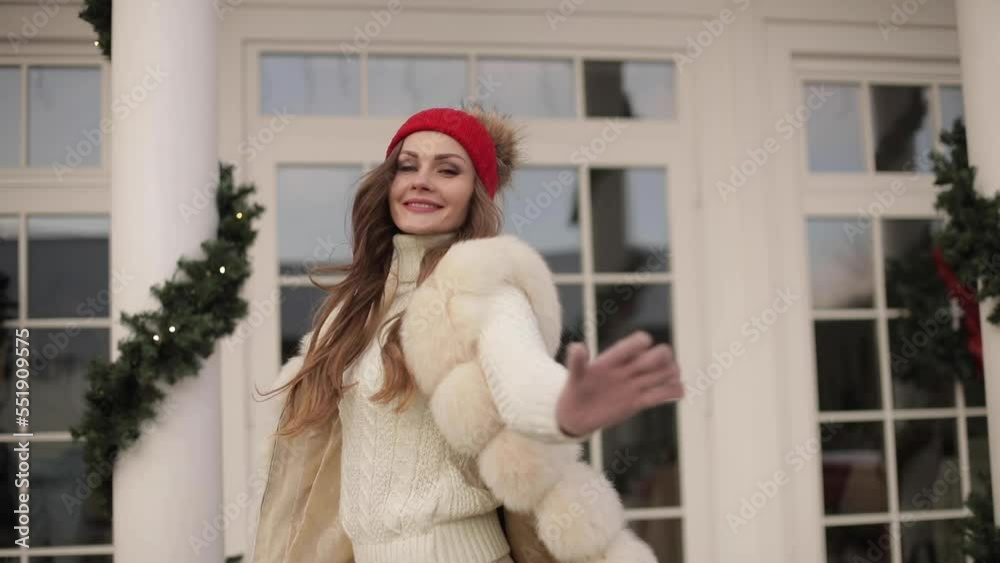 Pretty girl dancing outdoors at Christmas. Pretty girl dancing outdoors at Christmas.