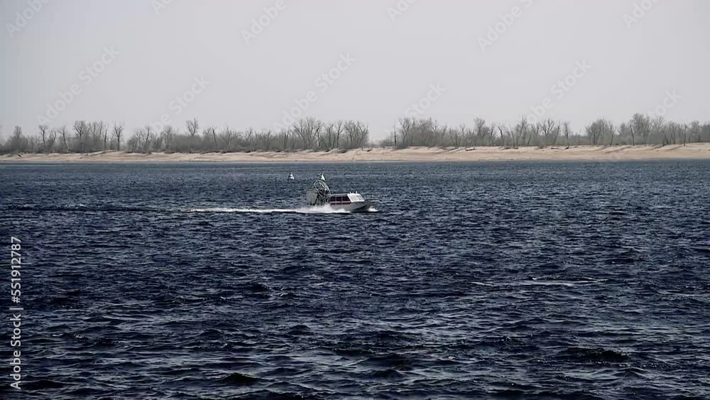 Police motorboat is moving fast on the river Police motorboat is moving fast on the river