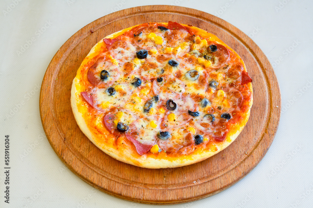 Delicious mixed pizza with rich content. Menu concept of choice and diversity. Karisik pizza Delicious mixed pizza with rich content. Menu concept of choice and diversity. Karisik pizza