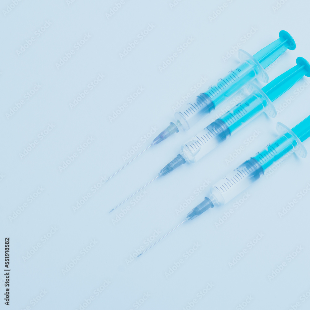 Medical syringe on a white background. A syringe for injection. The concept of health and beauty Medical syringe on a white background. A syringe for injection. The concept of health and beauty