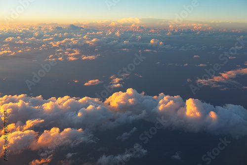 Evening clouds over the ocean . Clouds view from above in twilight