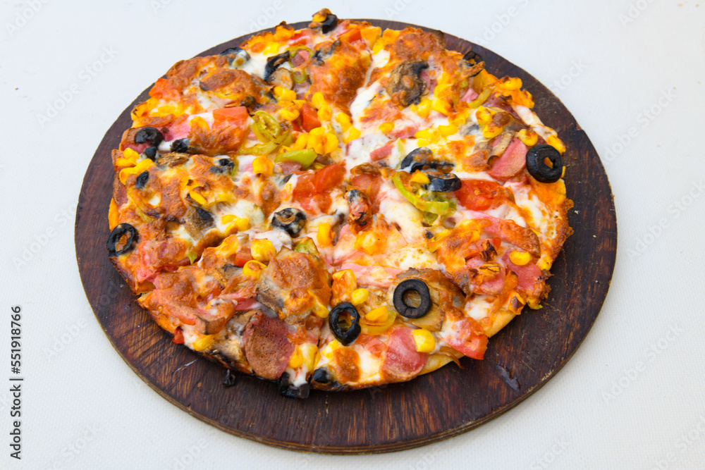 Delicious mixed pizza with rich content. Menu concept of choice and diversity. Karisik pizza Delicious mixed pizza with rich content. Menu concept of choice and diversity. Karisik pizza