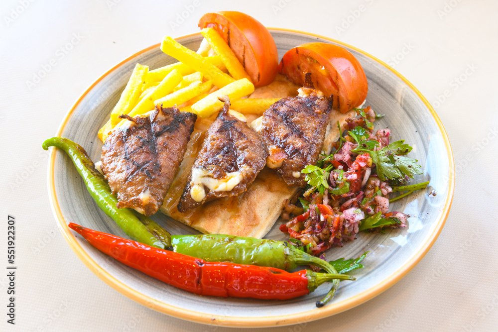 Beef steak grill with rice pilaf, fried potatoes, grilled pepper and tomatoes.Mix Platter with Beef rips, Cutlets, Potatoes and Sauces. Beef steak grill with rice pilaf, fried potatoes, grilled pepper and tomatoes.Mix Platter with Beef rips, Cutlets, Potatoes and Sauces.